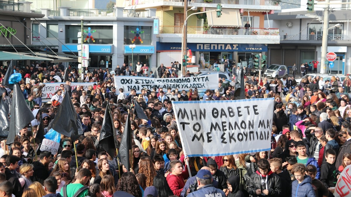people gathered in the streets in a rally